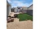 Backyard featuring new artificial turf, brick patio area, and storage shed at , Henderson, NV 89011