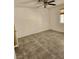 Cozy bedroom featuring tiled floors, ceiling fan, and a window for natural light at , Henderson, NV 89011