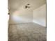Spacious living room featuring tiled floors, ceiling fan, and ample natural light at , Henderson, NV 89011
