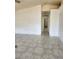 Bright living room with tiled floors, neutral walls and airy open space at , Henderson, NV 89011