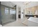 Spacious bathroom with glass shower and a soaking tub at 10718 Desert Heights Ave, Las Vegas, NV 89135