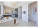 Modern bathroom with freestanding tub and glass enclosed shower at 10718 Desert Heights Ave, Las Vegas, NV 89135