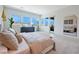 Bright bedroom with large windows, view, and light neutral decor at 10718 Desert Heights Ave, Las Vegas, NV 89135