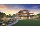 Beautiful community clubhouse with a pool, lawn and desert landscaping at 10718 Desert Heights Ave, Las Vegas, NV 89135