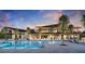 Resort-style community pool and clubhouse surrounded by mature trees and palm trees at 10718 Desert Heights Ave, Las Vegas, NV 89135