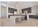 Modern kitchen with a large island, sleek cabinetry, and stainless steel appliances at 10718 Desert Heights Ave, Las Vegas, NV 89135
