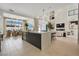 Bright, open kitchen featuring an island, modern appliances, and seamless flow to living space at 10718 Desert Heights Ave, Las Vegas, NV 89135