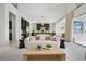 Open-concept living room with stylish furnishings and seamless flow to the kitchen area at 10718 Desert Heights Ave, Las Vegas, NV 89135