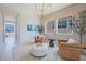 Cozy sitting room featuring high ceilings and neutral color palette at 10718 Desert Heights Ave, Las Vegas, NV 89135