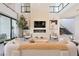 Bright, open living room featuring high ceilings, modern decor, and a cozy fireplace at 10718 Desert Heights Ave, Las Vegas, NV 89135