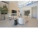 Spacious living room with soaring ceilings, modern decor, and abundant natural light at 10718 Desert Heights Ave, Las Vegas, NV 89135