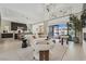 Elegant living room seamlessly connected to the kitchen and outdoor patio space at 10718 Desert Heights Ave, Las Vegas, NV 89135