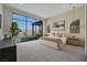 Elegant main bedroom with floor-to-ceiling windows and outdoor views at 10718 Desert Heights Ave, Las Vegas, NV 89135