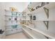 Well-organized pantry features white shelving and ample storage space for all your culinary needs at 10718 Desert Heights Ave, Las Vegas, NV 89135