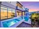 Stunning outdoor pool and backyard with a spa, covered patio, and modern landscaping at 10718 Desert Heights Ave, Las Vegas, NV 89135