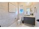 Stylish powder room featuring decorative wallpaper, a floating vanity, and elegant fixtures at 10718 Desert Heights Ave, Las Vegas, NV 89135