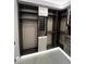 Walk-in closet with custom shelving and modern lighting at 10718 Desert Heights Ave, Las Vegas, NV 89135