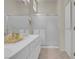 Bright bathroom features a single sink vanity with lots of storage and a glass enclosed shower at 11032 Mission Lakes Ave, Las Vegas, NV 89134