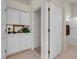 Bright bathroom features tile flooring, cabinetry, and a shower at 11032 Mission Lakes Ave, Las Vegas, NV 89134