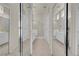 Mirrored bathroom showing cabinets, vanities, and walk-in shower at 11032 Mission Lakes Ave, Las Vegas, NV 89134