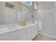 Bright bathroom features a double sink vanity with lots of storage and a glass enclosed shower at 11032 Mission Lakes Ave, Las Vegas, NV 89134