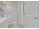 Bright bathroom features a single sink vanity with lots of storage and a glass enclosed shower at 11032 Mission Lakes Ave, Las Vegas, NV 89134
