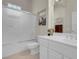 Bright bathroom features a toilet, single sink vanity with a shower and tub combo at 11032 Mission Lakes Ave, Las Vegas, NV 89134