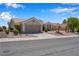 Charming single-story home featuring desert landscaping and a two-car garage at 11032 Mission Lakes Ave, Las Vegas, NV 89134