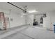 View of the garage with painted walls, concrete flooring, and ample space for parking or storage at 11032 Mission Lakes Ave, Las Vegas, NV 89134