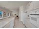 Bright kitchen with white cabinets, tile floor, and modern appliances at 11032 Mission Lakes Ave, Las Vegas, NV 89134