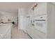 Bright kitchen with white cabinets, tile floor, and modern appliances at 11032 Mission Lakes Ave, Las Vegas, NV 89134