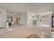 View of open floor plan with tile and carpet flooring, connecting living room and kitchen at 11032 Mission Lakes Ave, Las Vegas, NV 89134
