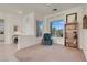 Relaxing room with comfortable armchair and sunlit window views at 11032 Mission Lakes Ave, Las Vegas, NV 89134