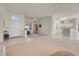 Open-concept living room seamlessly connects to the entryway and kitchen area at 11032 Mission Lakes Ave, Las Vegas, NV 89134