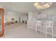 Open concept living room with breakfast bar and bright natural light at 11032 Mission Lakes Ave, Las Vegas, NV 89134