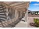 Shaded patio area, perfect for outdoor living, with views of the desert landscaped backyard at 11032 Mission Lakes Ave, Las Vegas, NV 89134