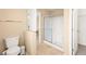 Bathroom featuring tile flooring, walk-in shower with glass door, and toilet at 11135 Abbeyfield Rose Dr, Henderson, NV 89052