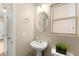 Half bathroom featuring a pedestal sink, and neutral colored walls and floors at 11135 Abbeyfield Rose Dr, Henderson, NV 89052