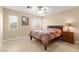 Bright bedroom showcasing natural light, neutral color scheme, and ceiling fan at 11135 Abbeyfield Rose Dr, Henderson, NV 89052