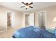 Bedroom featuring a ceiling fan, and a walk-in closet at 11135 Abbeyfield Rose Dr, Henderson, NV 89052