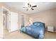 Bedroom featuring a ceiling fan, and a walk-in closet at 11135 Abbeyfield Rose Dr, Henderson, NV 89052