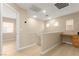 Hallway with built-in desk space, wood floors, and access to multiple rooms at 11135 Abbeyfield Rose Dr, Henderson, NV 89052