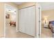 Hallway with closet leading to bedrooms with nice floors and natural light at 11135 Abbeyfield Rose Dr, Henderson, NV 89052