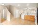 Entryway with stairs leading to the second floor and view of the kitchen and dining area at 11135 Abbeyfield Rose Dr, Henderson, NV 89052