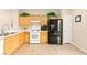 Functional kitchen with black appliances and plenty of cabinet storage at 11135 Abbeyfield Rose Dr, Henderson, NV 89052