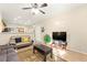 Spacious living room with tile flooring, contemporary furnishings, and neutral decor at 11135 Abbeyfield Rose Dr, Henderson, NV 89052