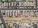 Overhead shot showing a street lined with houses, several with private pools and solar panels on the roofs at 1124 Aspen Cliff Dr, Henderson, NV 89011