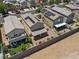 Aerial view of the home with solar panels, covered patio, and desert landscaping at 1124 Aspen Cliff Dr, Henderson, NV 89011