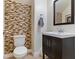 Modern powder room with stylish accent wall and sleek vanity at 1124 Aspen Cliff Dr, Henderson, NV 89011