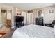 Spacious bedroom featuring a TV, decor, and a luxurious queen-size bed at 1124 Aspen Cliff Dr, Henderson, NV 89011